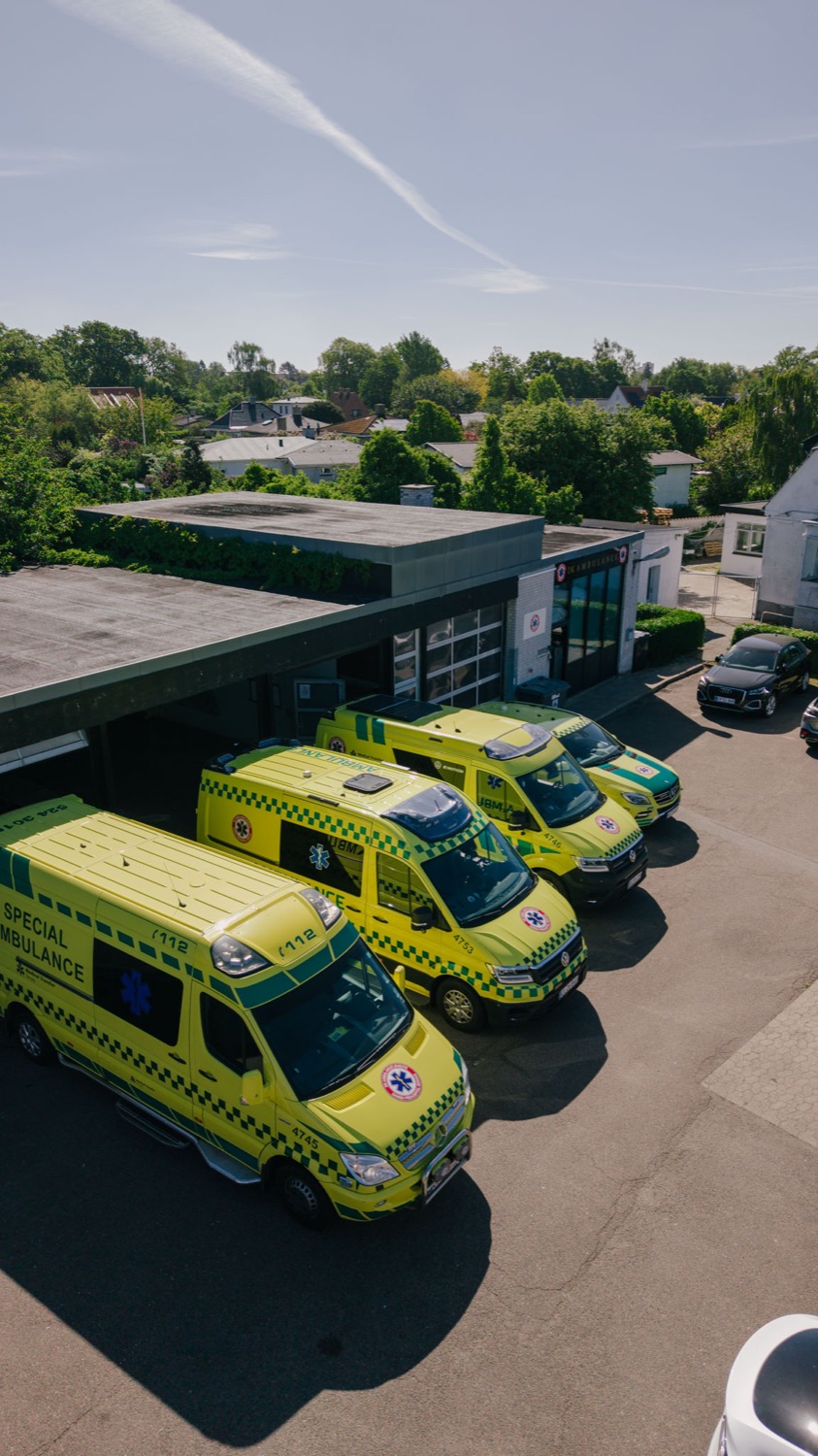 Drone photo of DK Ambulancetjeneste’s fleet in front of the base