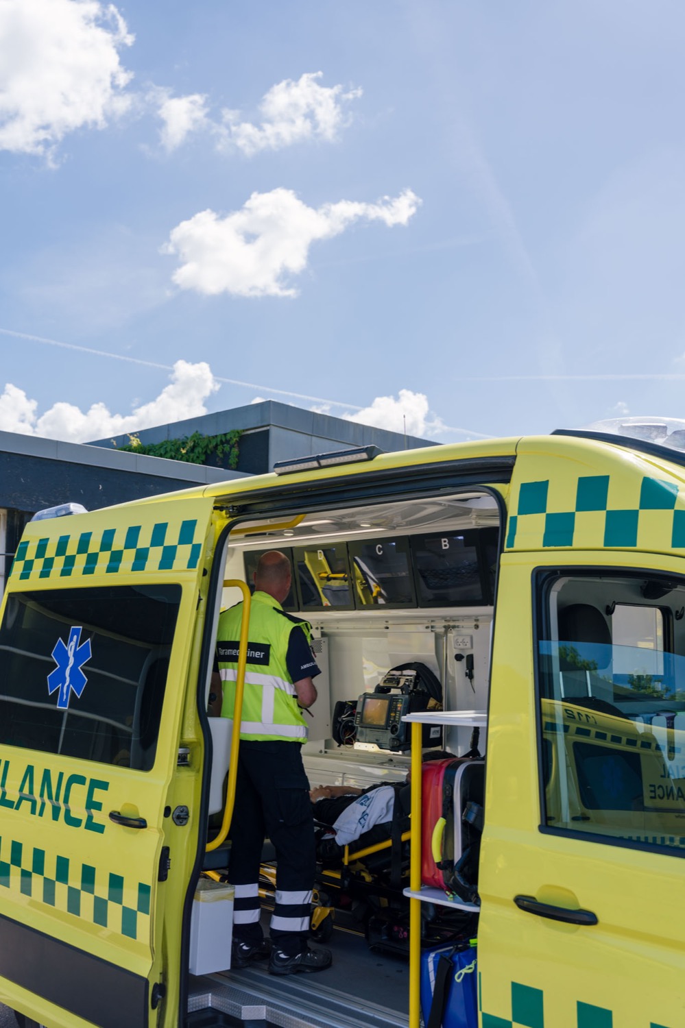 Paramedic preparing the ambulance with stretcher and equipment