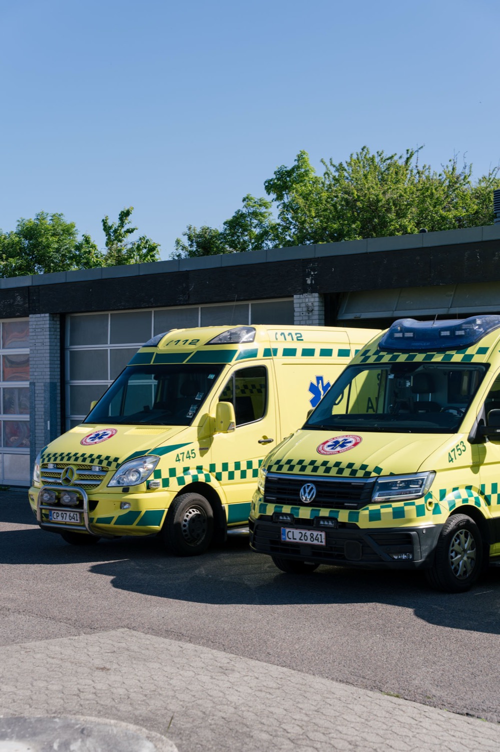 Two of DK Ambulancetjeneste’s ambulances ready in front of the base